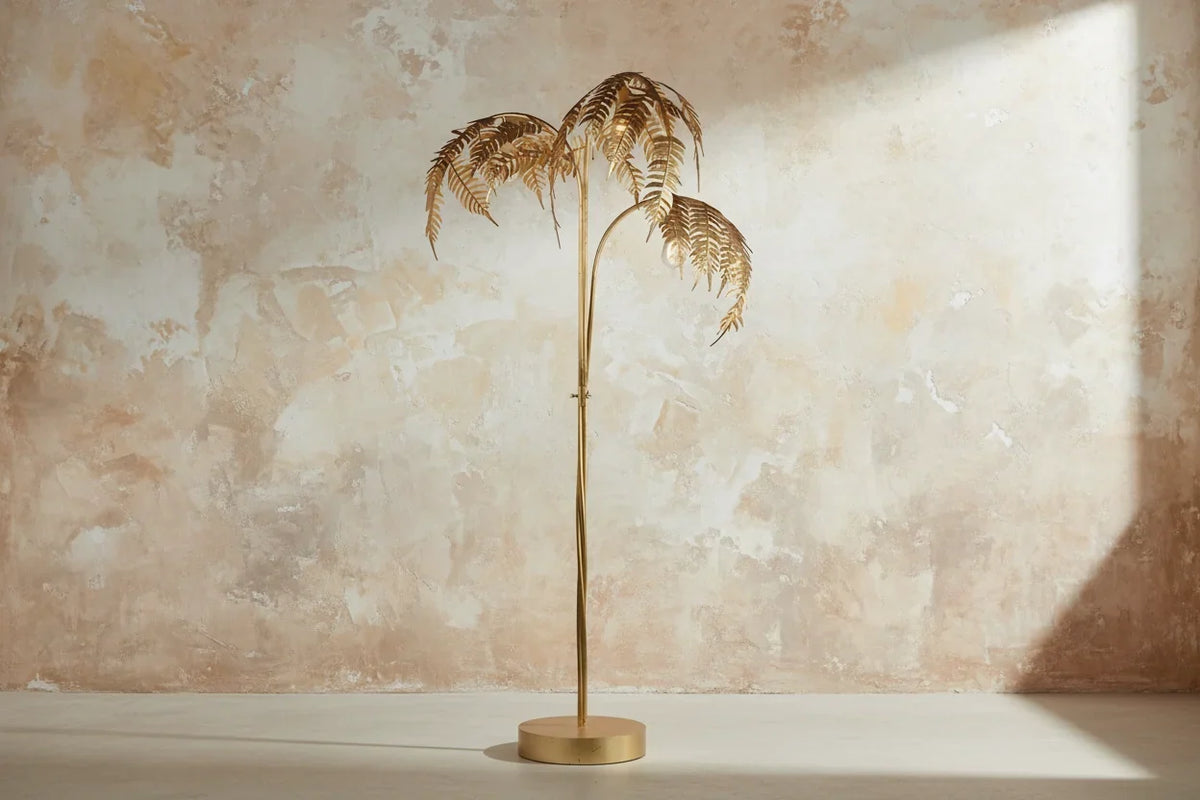 Full-length gold palm tree floor lamp with round base