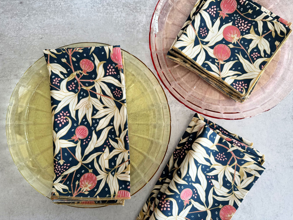 Cloth napkins set of four, navy floral print with pink and cream leaves, folded square