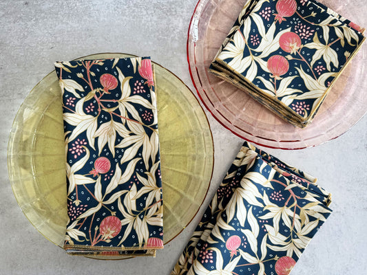 Cloth napkins set of four, navy floral print with pink and cream leaves, folded square