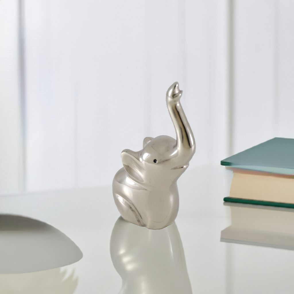 Silver elephant ring holder figurine with curved trunk and open top