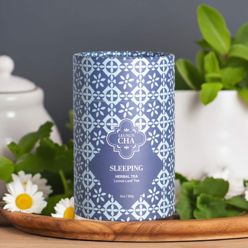 Blue patterned sleeping herbal tea tin on a wooden tray, front label visible