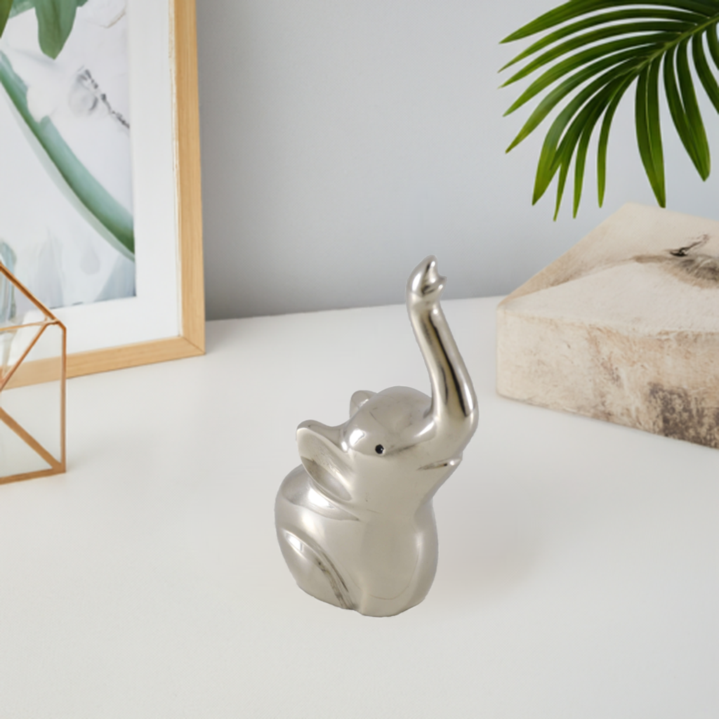 Silver elephant ring holder with two upright ears and an open top