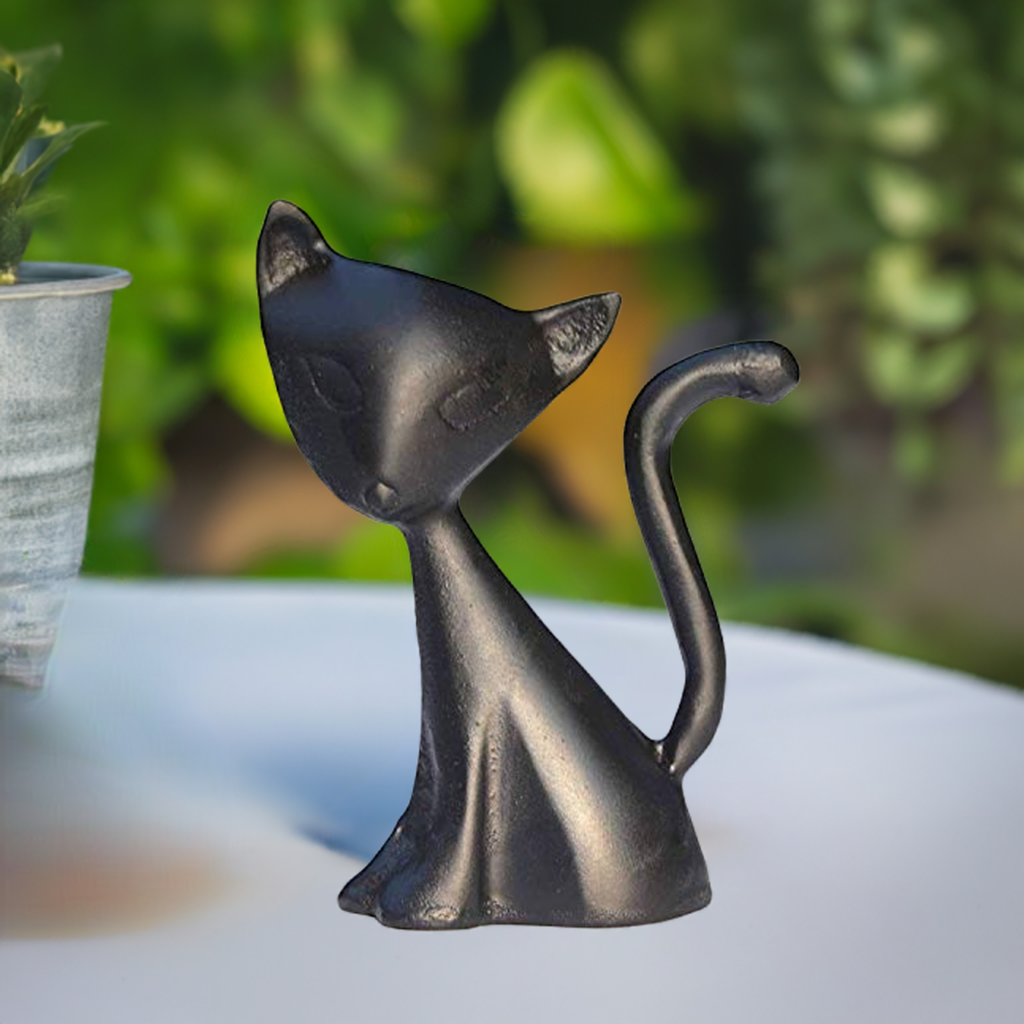 Dark cat ring holder figurine with curled tail, resting pose, and raised head detail.