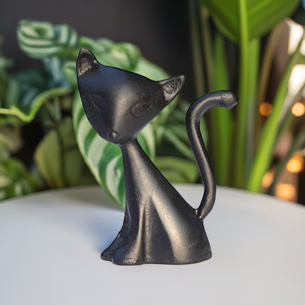 Black cat ring holder figurine with arched back, curled tail, and molded cat face.