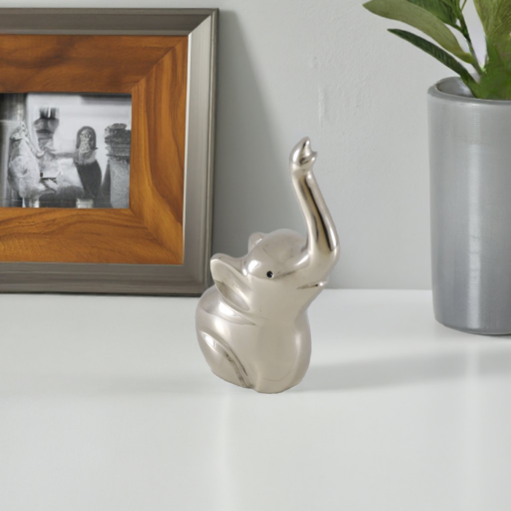 Silver elephant ring holder with upright trunk and smooth rounded body