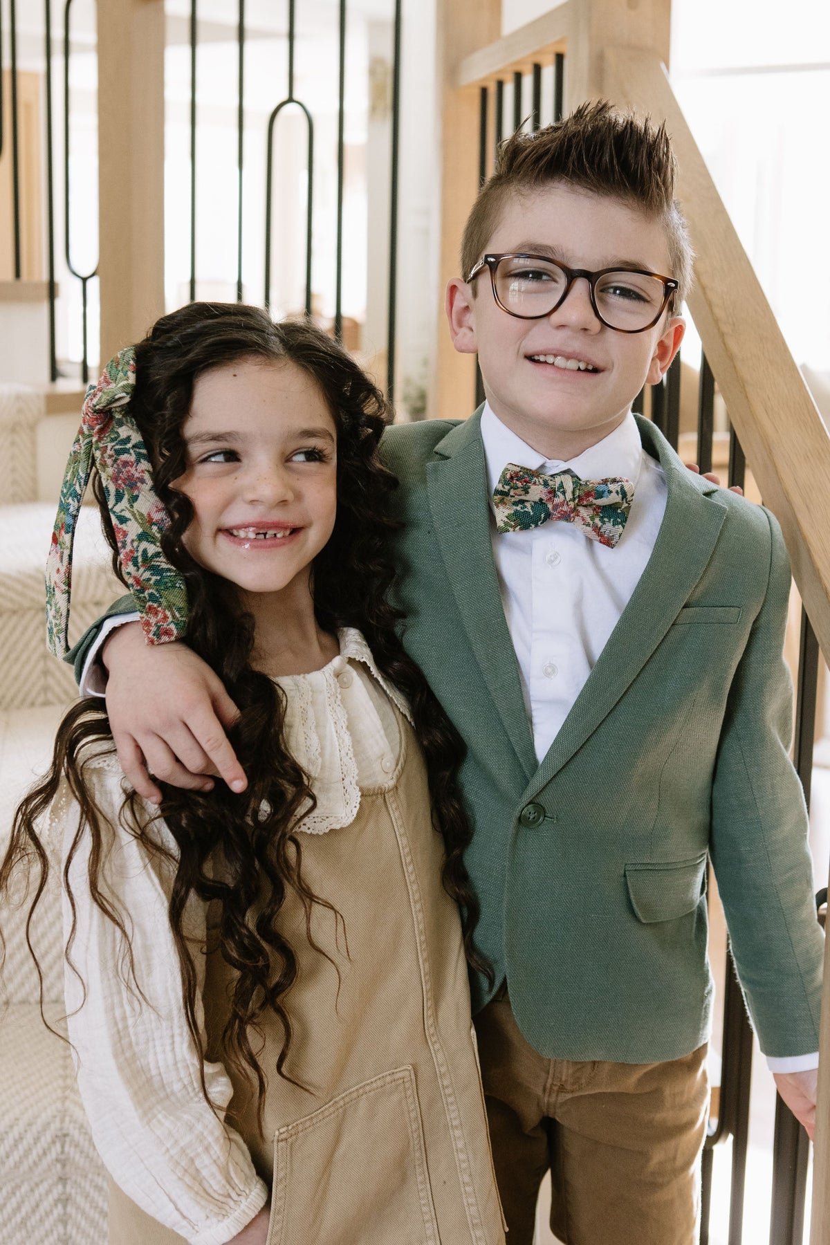 Floral plaid bow on girl’s long hair with long ribbon tails