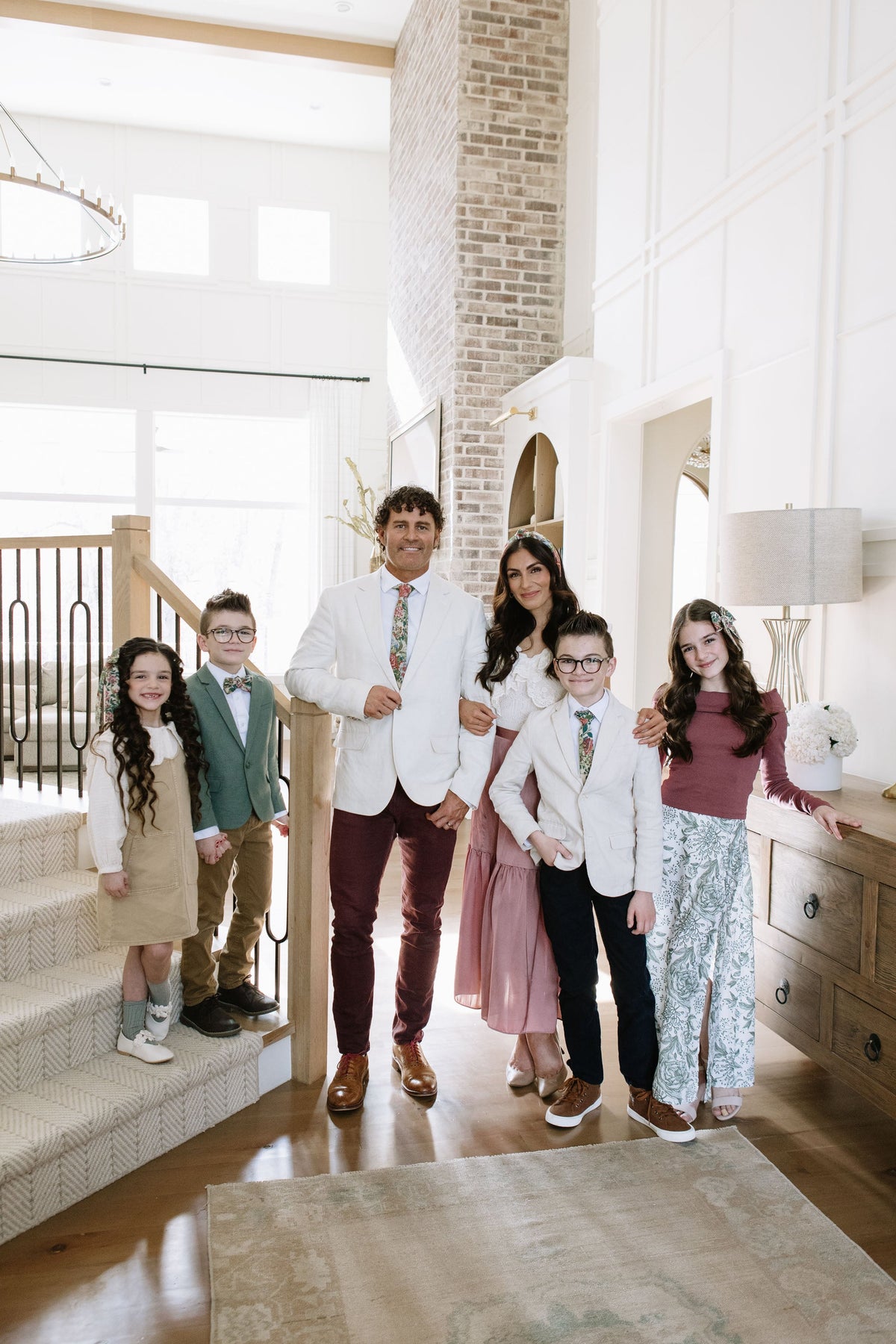 Group wearing coordinated green floral patchwork necktie and bow tie