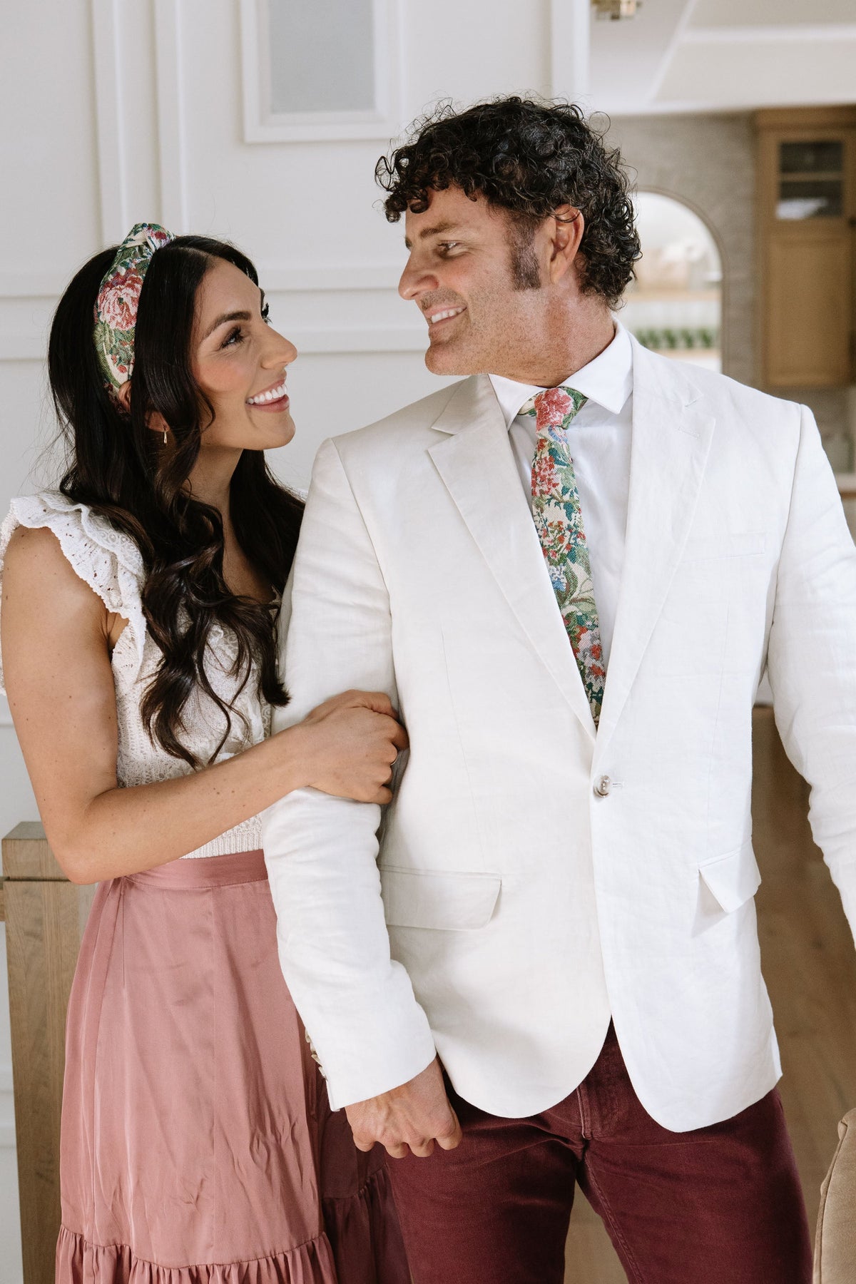 Men's tie with multicolor foliage pattern on white dress shirt
