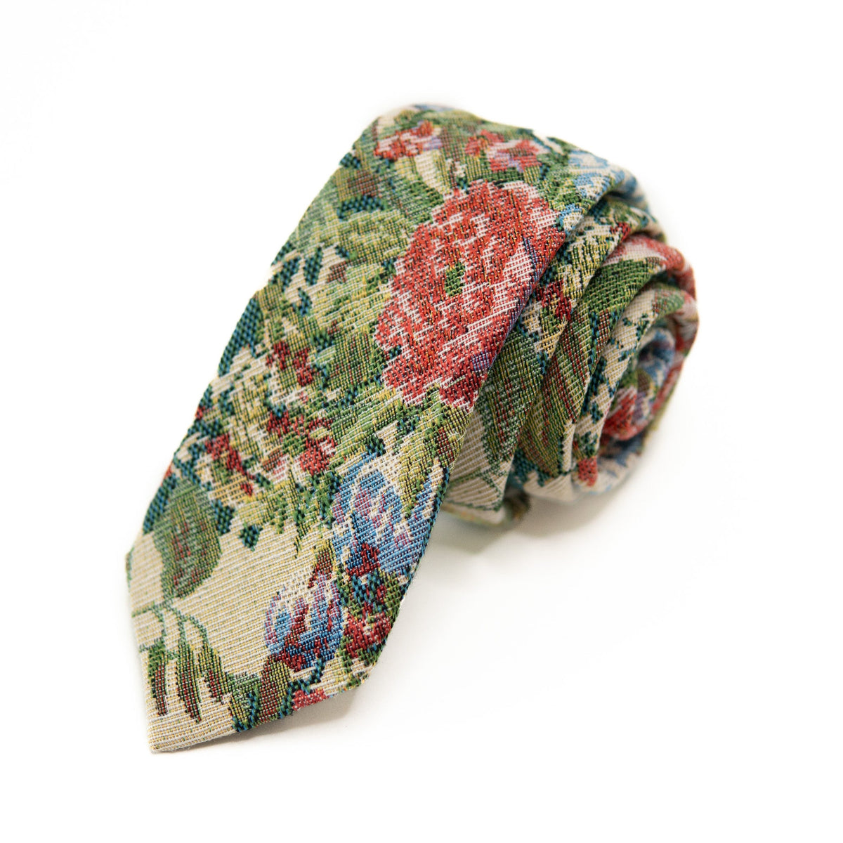Men's tie with folded green, red and cream geometric weave pattern