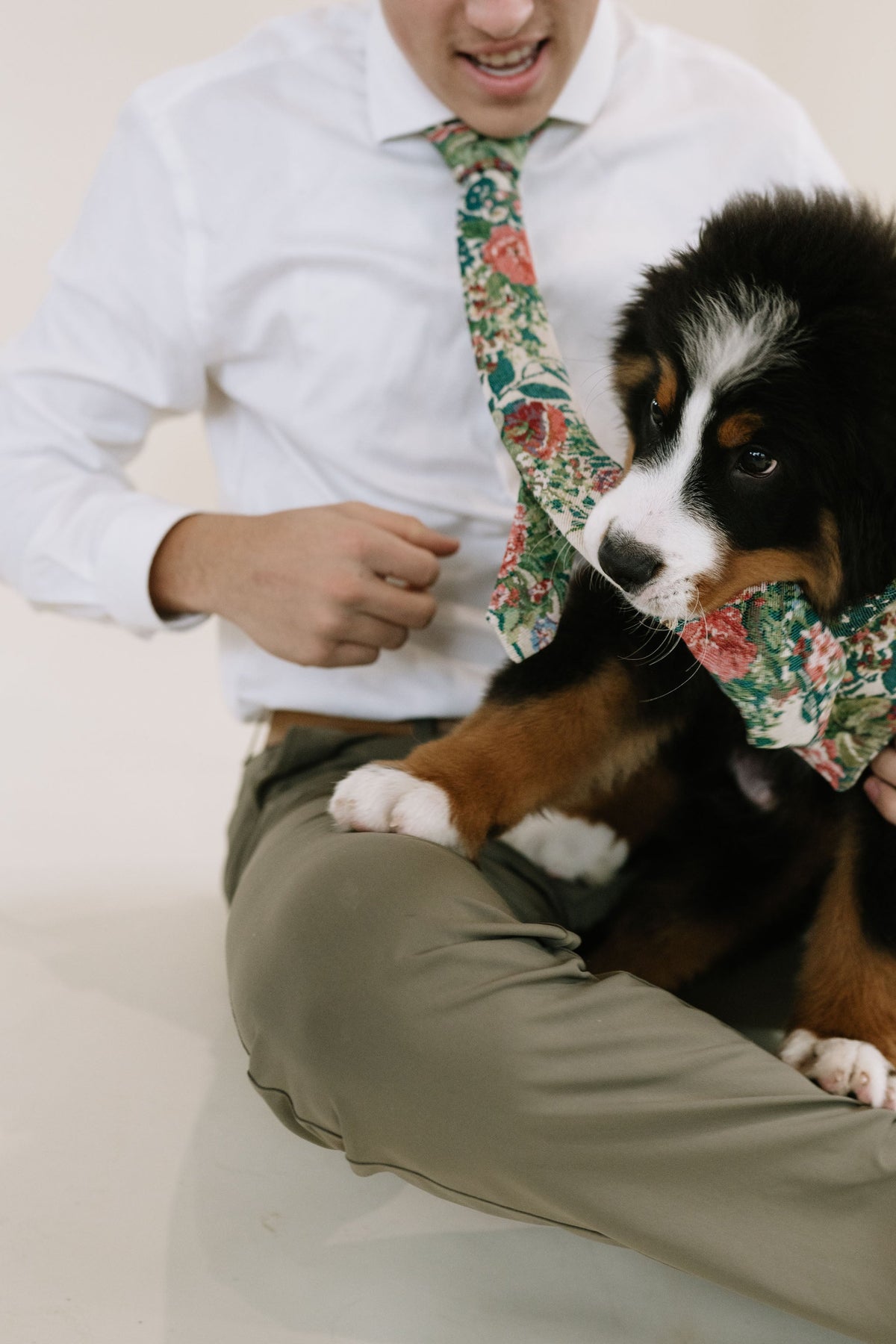 Men's tie with green, red and cream collage-style pattern