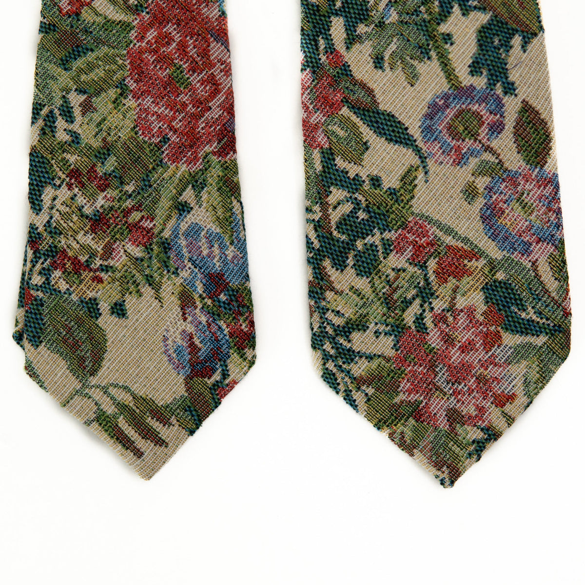 Men's tie pair view: green and cream base with red and blue detail weave