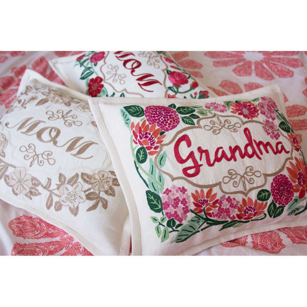 Pair of embroidered pillows with 'Grandma' floral border on off-white