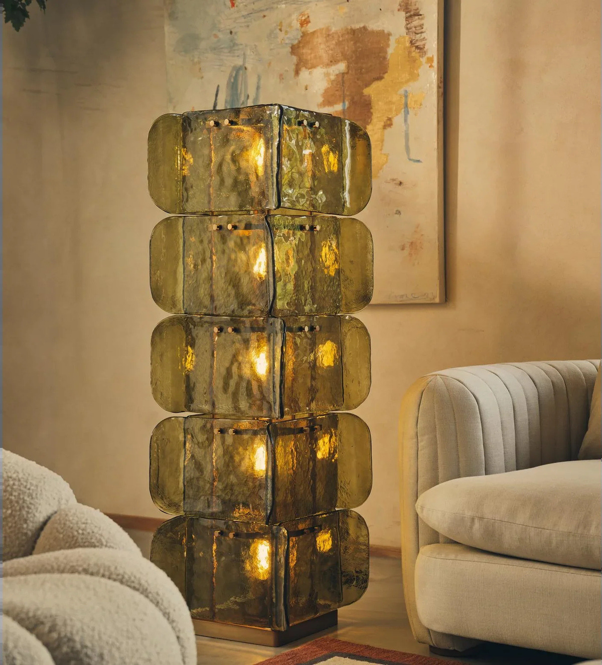 Green glass floor lamp with stacked panels in a living room