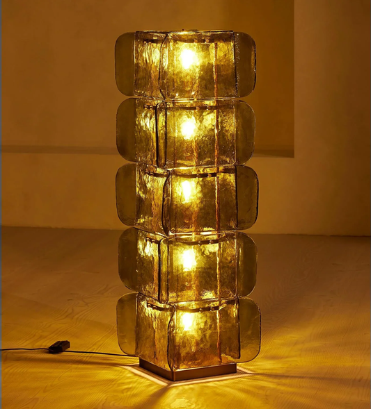 Illuminated green glass floor lamp with five stacked panels