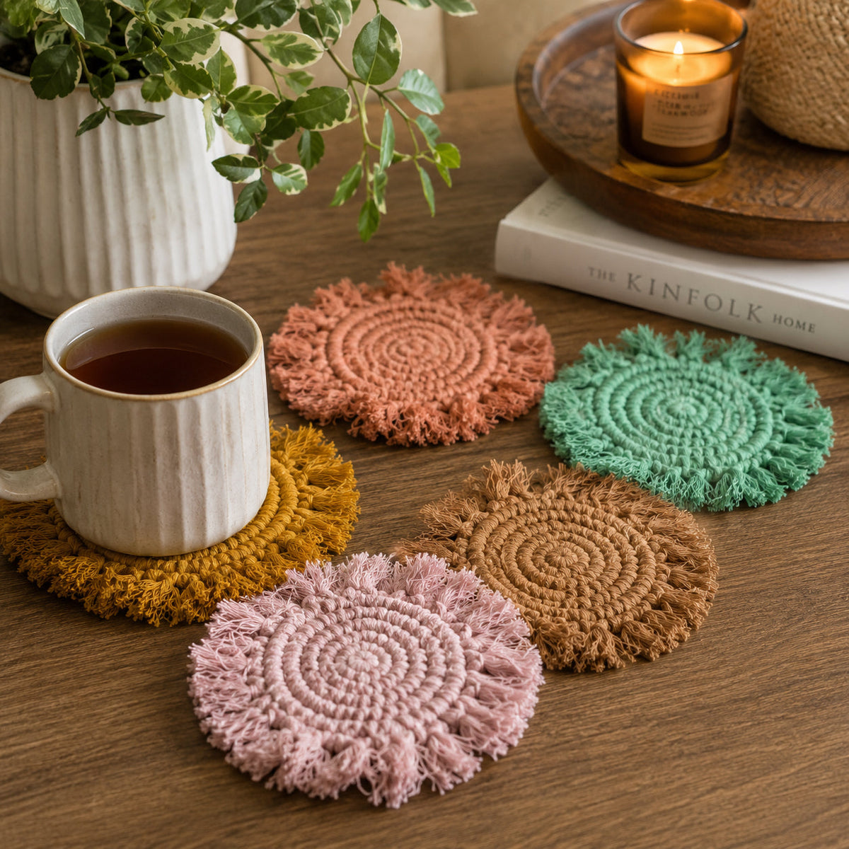 Pastel braided rope coasters: pink, green, tan, and mustard with circular spiral design