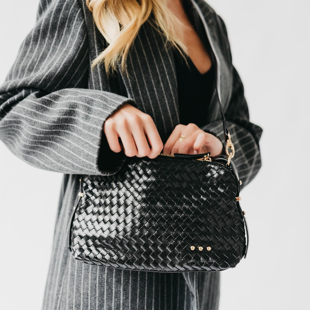 Woven hobo shoulder bag in black with braided texture and gold chain strap