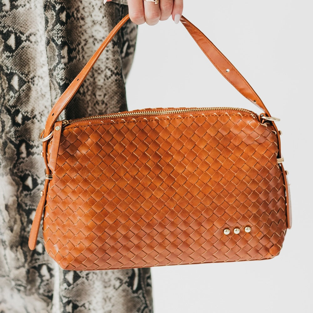 Woven hobo shoulder bag in brown with top zip and three gold stud accents