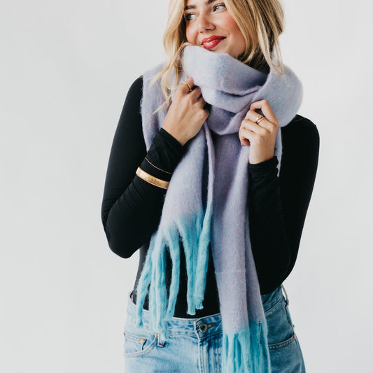 Lavender blanket scarf with long fringe, worn wrapped around the neck