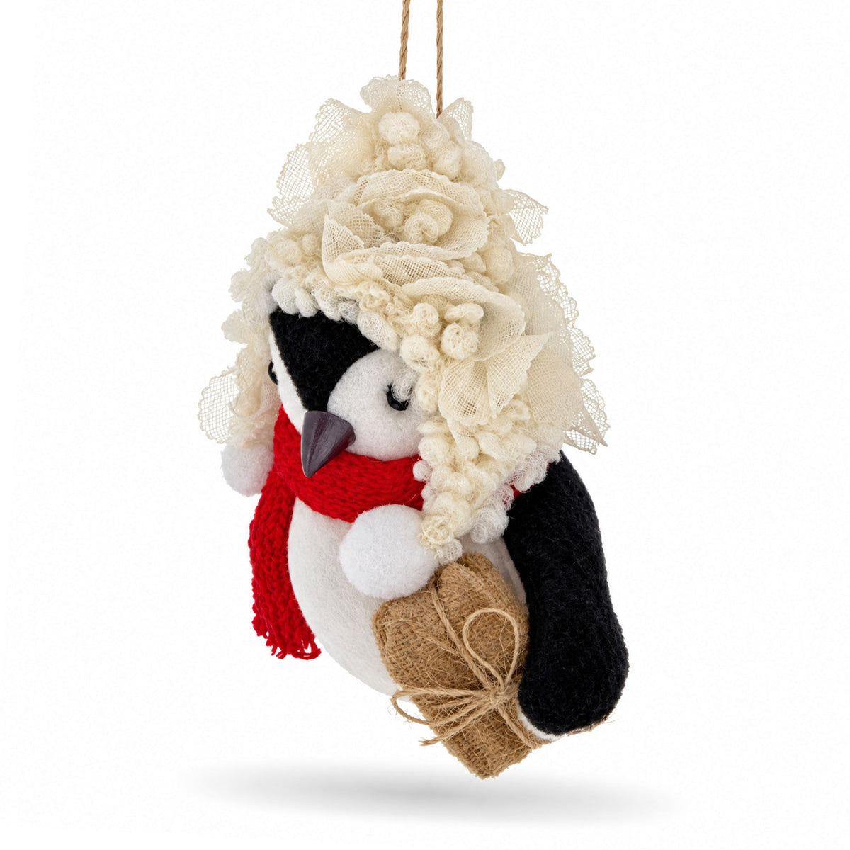 Felt penguin ornament with textured cream hood, red scarf, and burlap gift pouch
