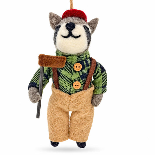 Felt raccoon ornament with red cap, green plaid vest, tan overalls, holding a cane