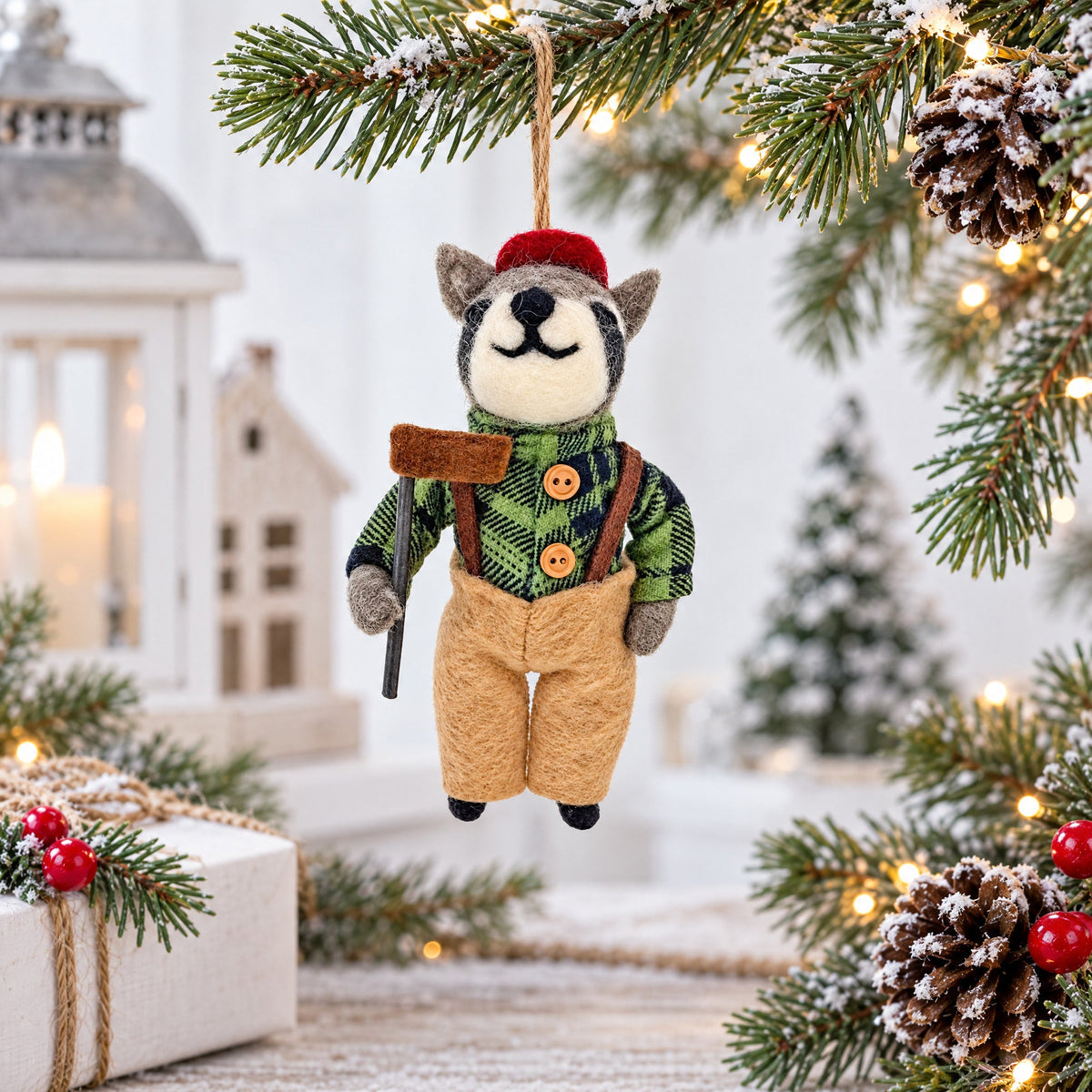 Felt raccoon ornament, red cap and green plaid vest, tan overalls, dangling from string