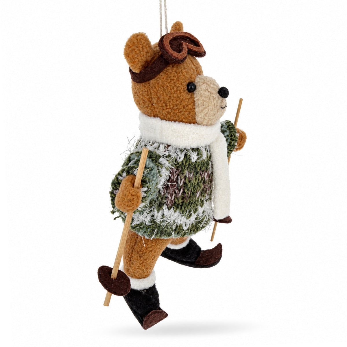 Skiing bear felt ornament in profile with ski poles and white scarf over green sweater