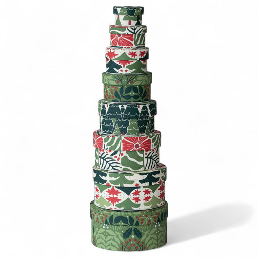 Stack of round green botanical nesting gift boxes, handmade recycled paper