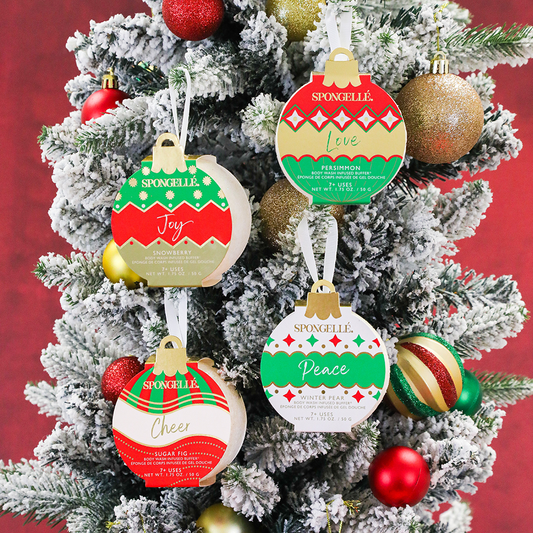 Assorted holiday ornament shower buffers on a Christmas tree, colorful designs