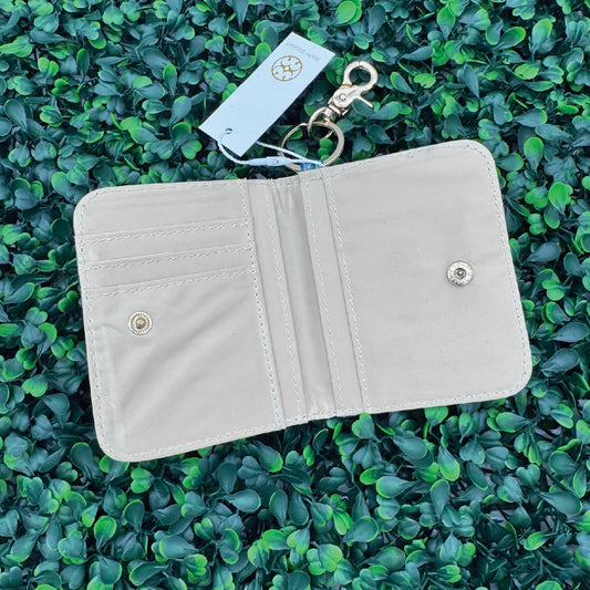 White ID wallet open with card slots and snap button