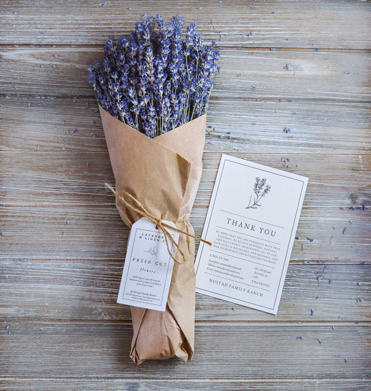 Dried lavender bundle in kraft paper wrap with two attached thank-you tags