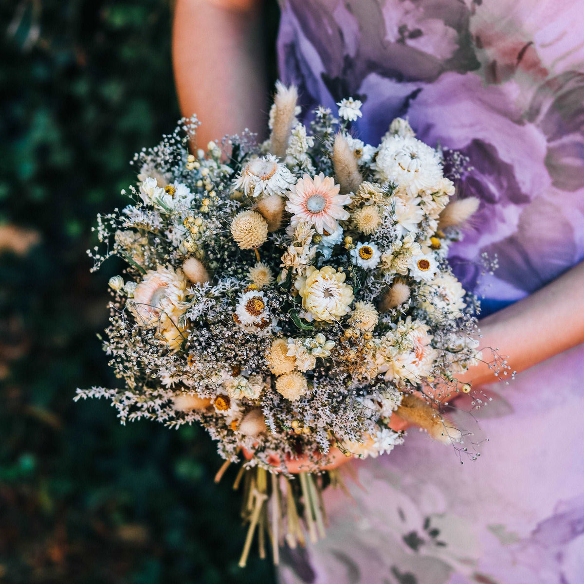 Blush and cream dried flower bouquet with strawflower blooms and tiny filler sprigs