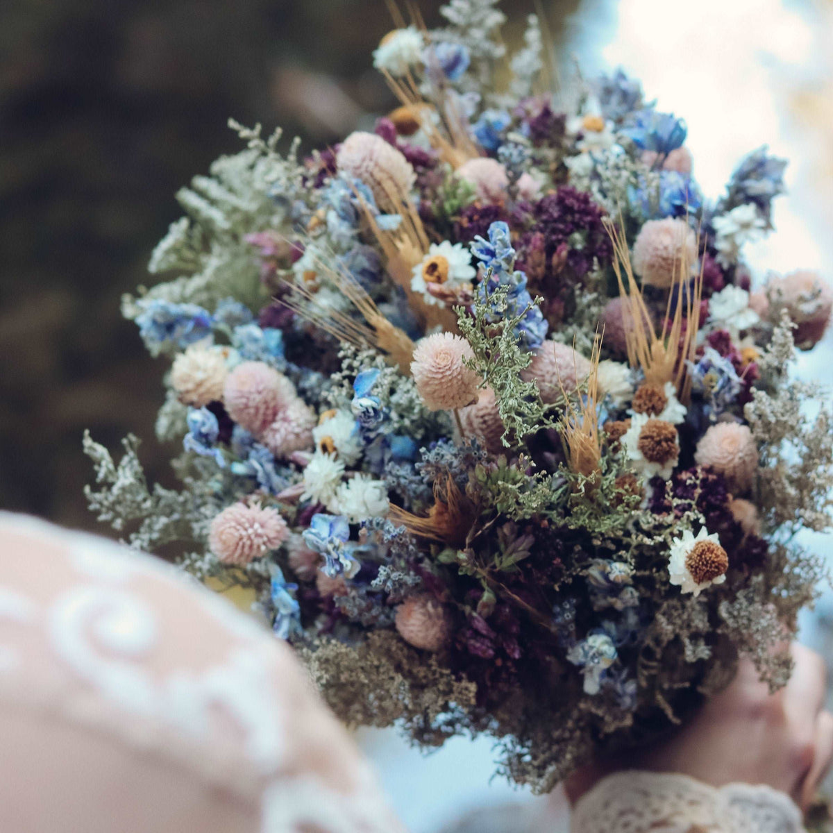 Large dried wildflower bouquet with blue and tan flower heads