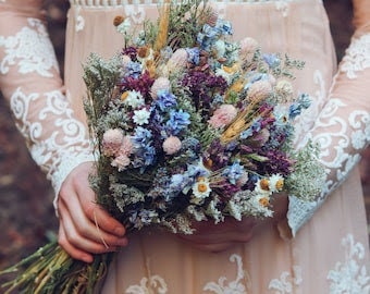 Dried wildflower bridal bouquet in blue, purple, and cream hues