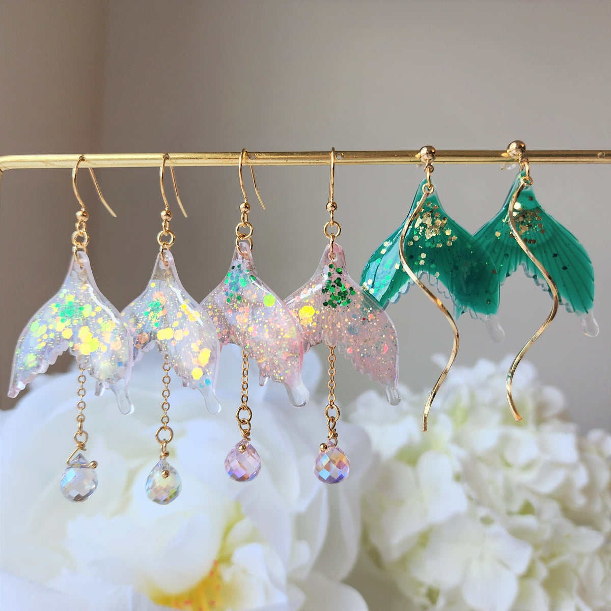 Green and iridescent glitter mermaid tail dangle earrings on gold hooks