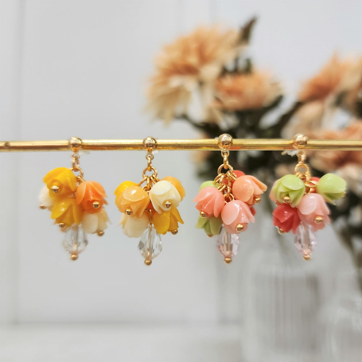 Gold-tone dangle tulip bouquet earrings in yellow, orange, pink, and green with clear drops