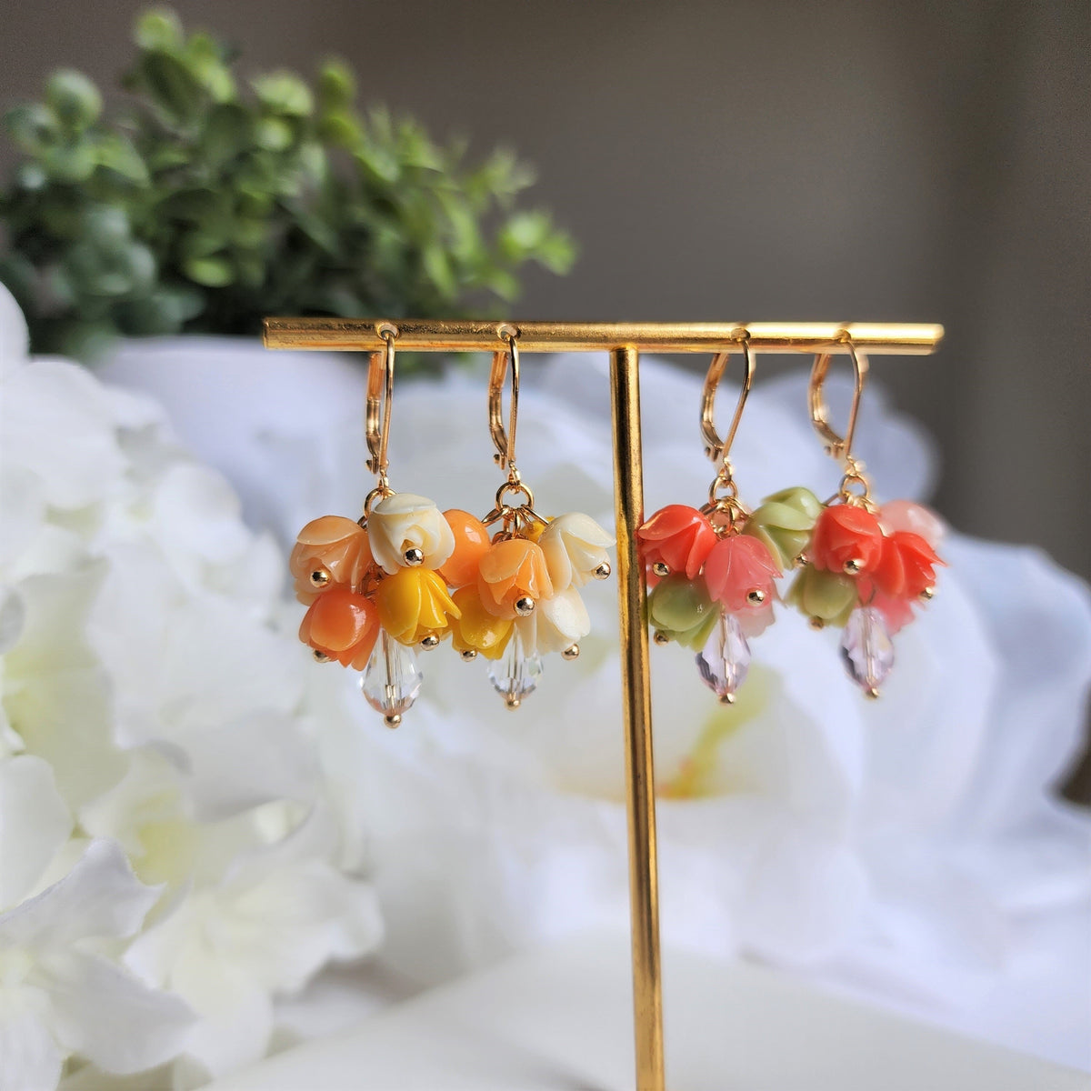 Gold-tone tulip bouquet earrings with dangling flower charms and clear teardrop accents