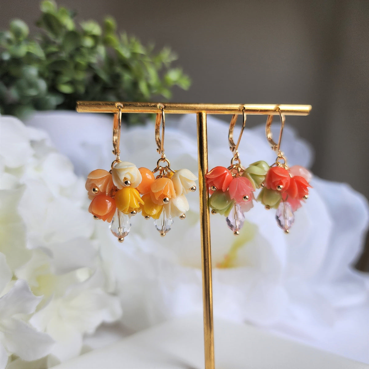 Gold-tone tulip bouquet earrings with orange, peach, pink, and green dangling flower charms