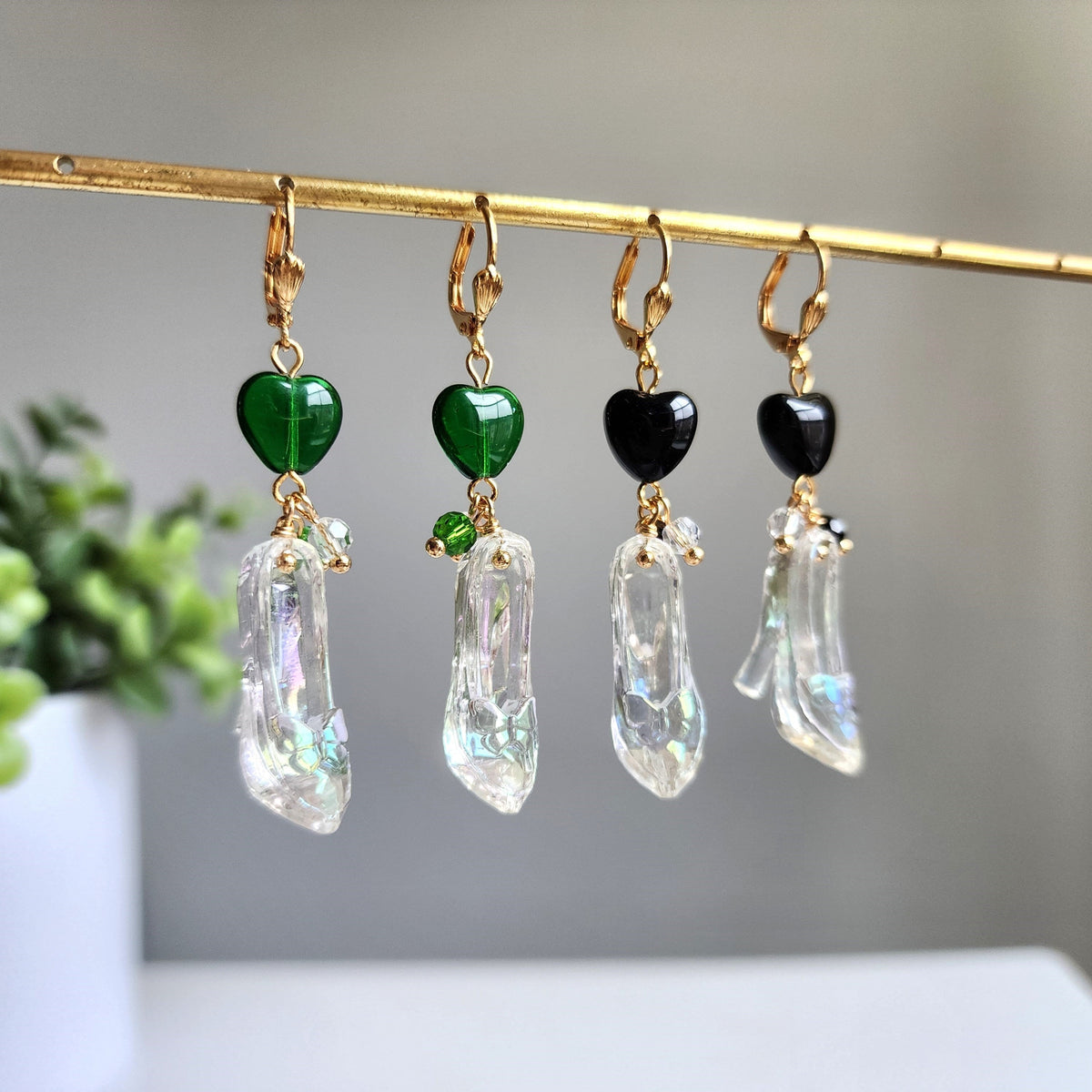 Cinderella glass slipper earrings with green and black heart charms and clear dangling slippers