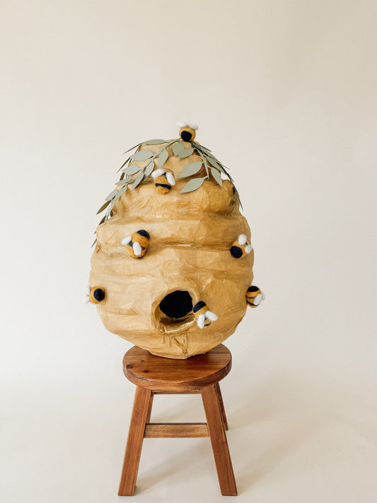 Honey beehive pinata decoration with open mouth and small bee accents