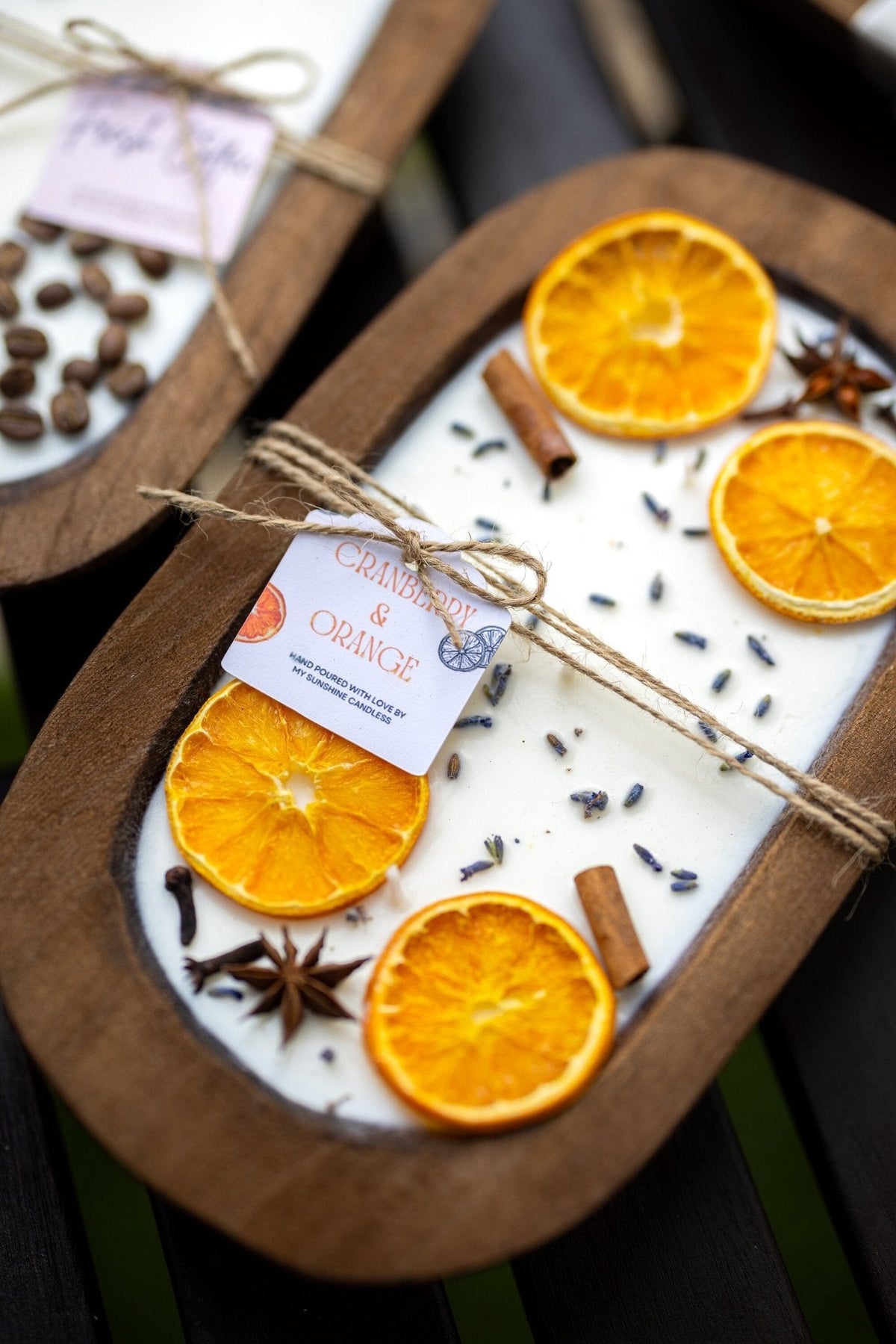 Soy candle in orange dough bowl with orange slices, anise star, and cinnamon stick