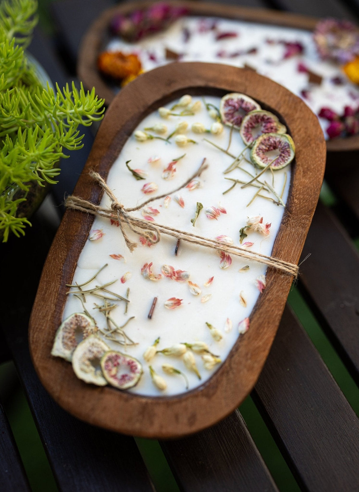 Wood dough bowl candle in round wooden tray, white wax with dried botanicals