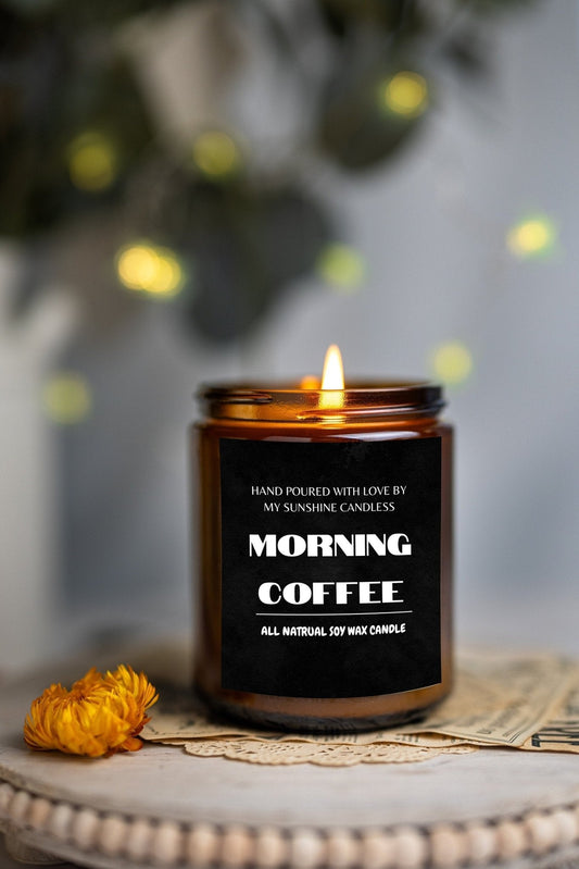 Amber jar soy wax candle with lit wick and “Morning Coffee” label