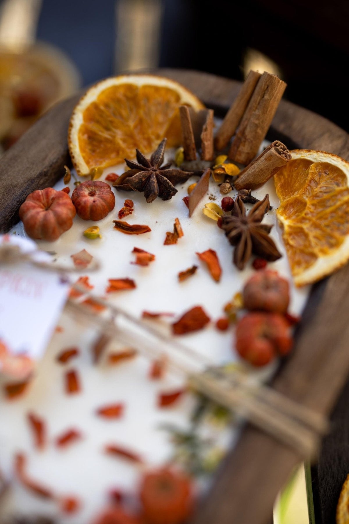Large wooden candle bowl with dried orange slices, star anise, cinnamon sticks, pumpkin spice wax