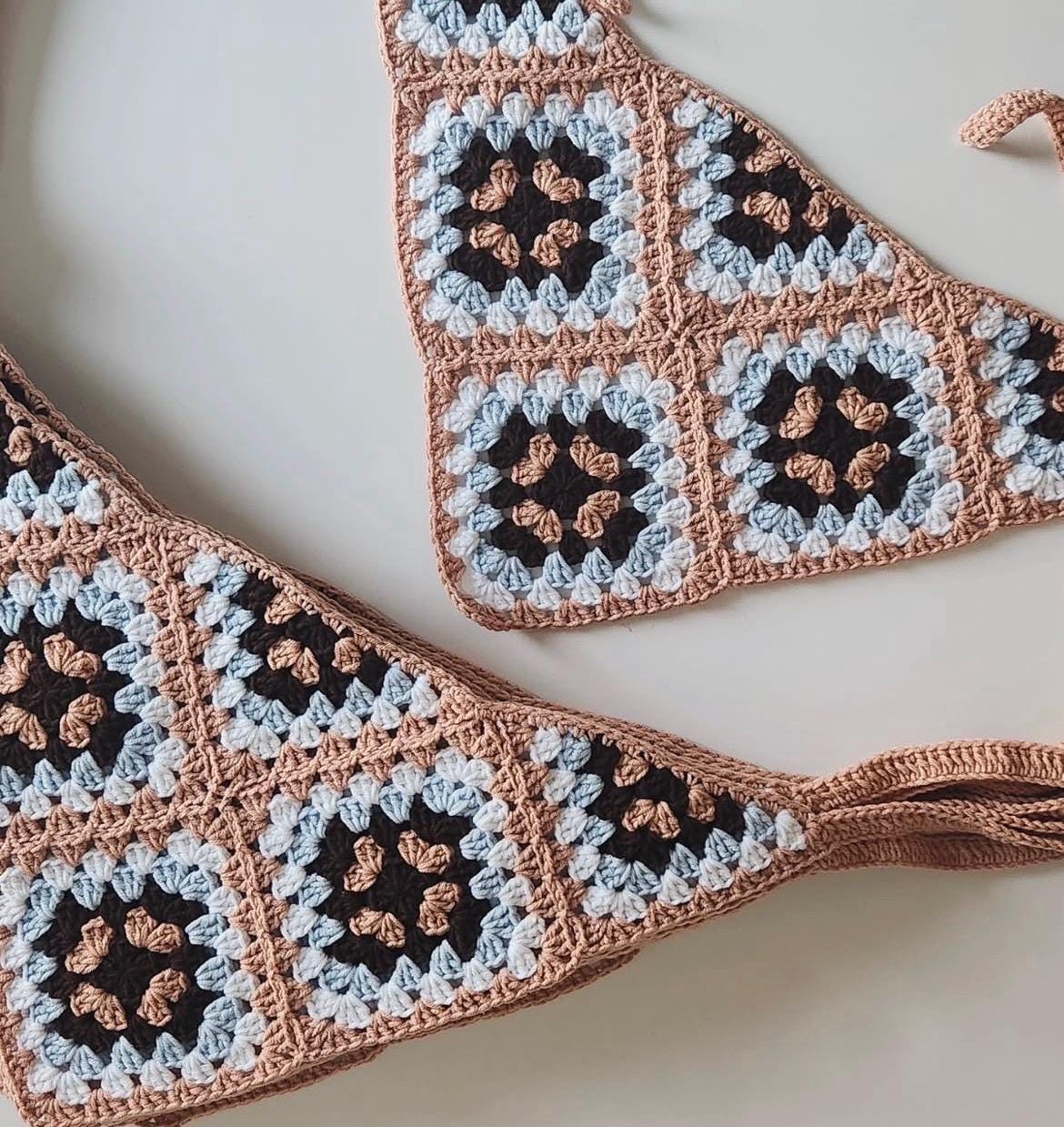 Crochet bandana with brown, light blue, and black granny squares and long tie