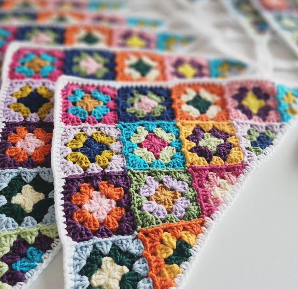 Colorful crochet bandana with multicolor granny square patches and scalloped edging