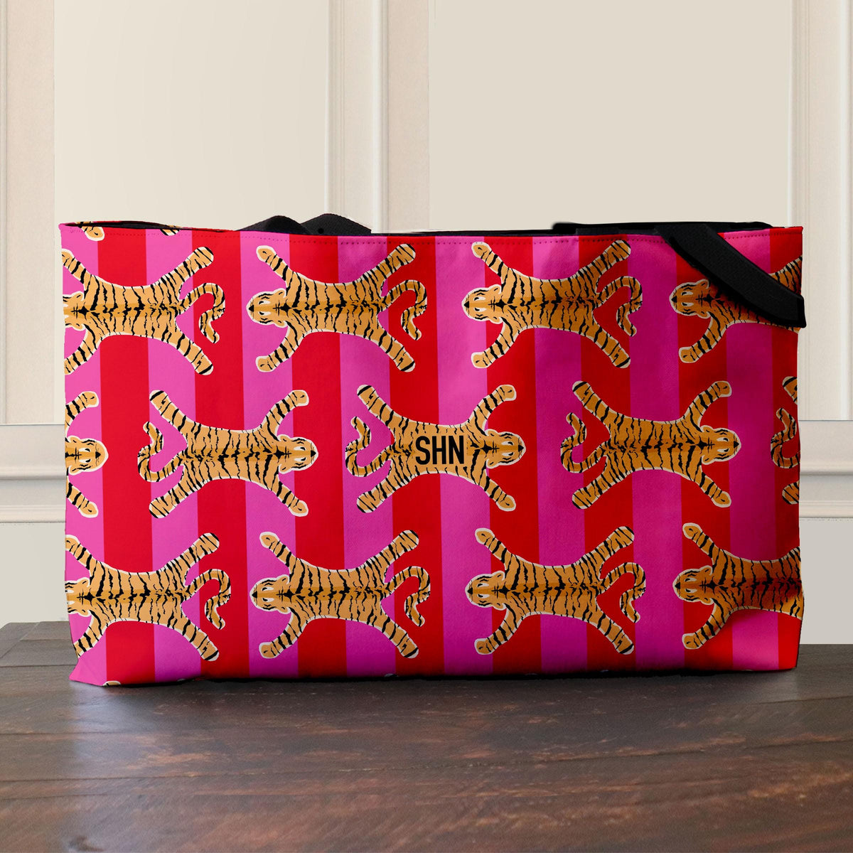 Tiger-print tote bag with black webbed handles