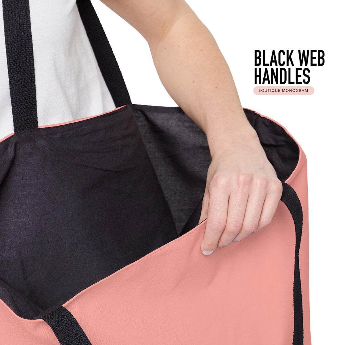 Tote bag interior with black web handles, black lining, and pink trim
