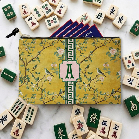 Personalized mahjong card and tile bag with yellow floral print, green trim, and monogram