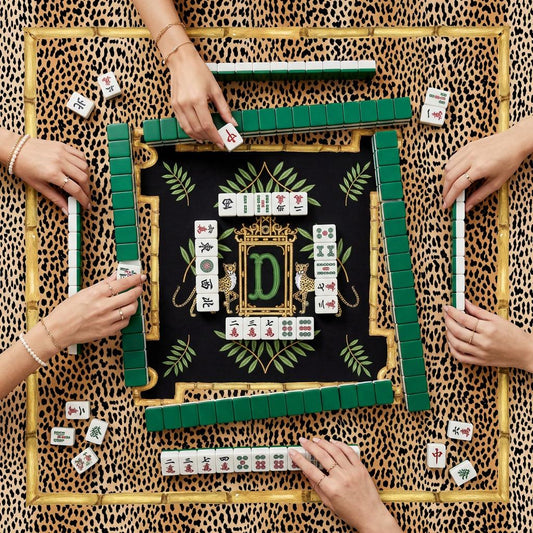 Custom Romy mahjong mat with leopard print border, black center, and gold and green design