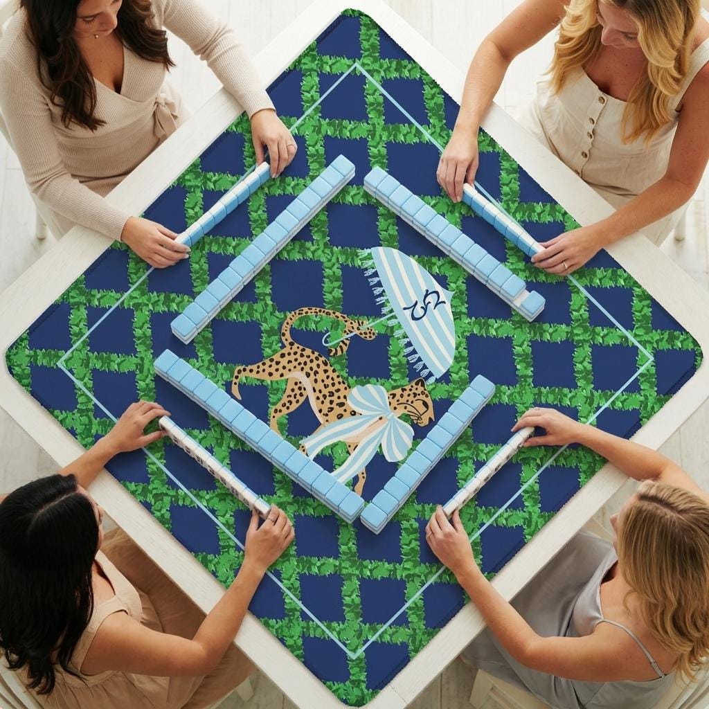 Trixie Mahjong mat laid out for play, featuring a blue and green pattern and leopard illustration
